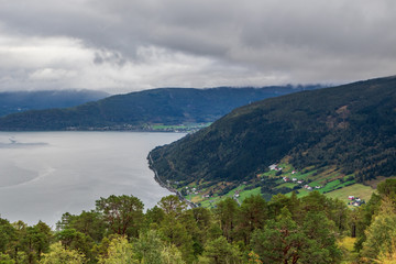 Fototapeta na wymiar Cloudy summer day in Norway fjord nature travel 