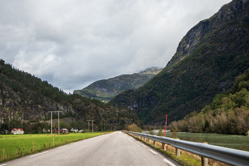 Mountains cloudy road in scandinavia nature travel 