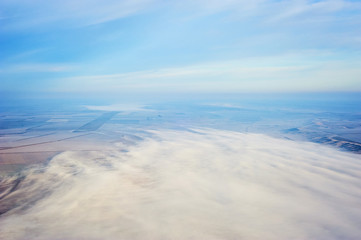 Naklejka na ściany i meble Aerial landscape. Fog above the fields. Bird eye view