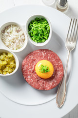 Tasty beef tartare with fresh and healthy ingredients