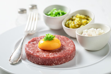 Enjoy your beef tartare with yolks, chives and pepper