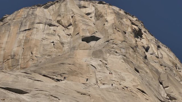 Rock climbers on El Capitan or El Cap rock formation in Yosemite National Park
