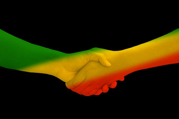 Green yellow red on human hand reggae background concept