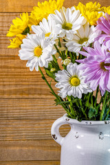 Daisies and Chrysanthemums in a Milk Jug