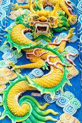 Scenery in a Chinese temple, a beautiful dragon statue at the entrance to the castle