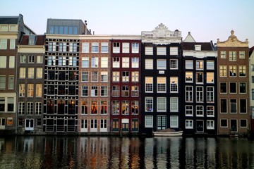 Reflection of Amsterdam houses in the canal
