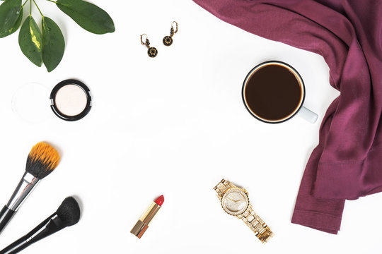 woman trendy fashion purple clothes collage on white, flat lay, top view cup of coffee, green leaf, watch, earrings, red lipstick, makeup brushes, eye shadow - Powered by Adobe