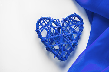 Blue hearts and silk ribbon on a white background