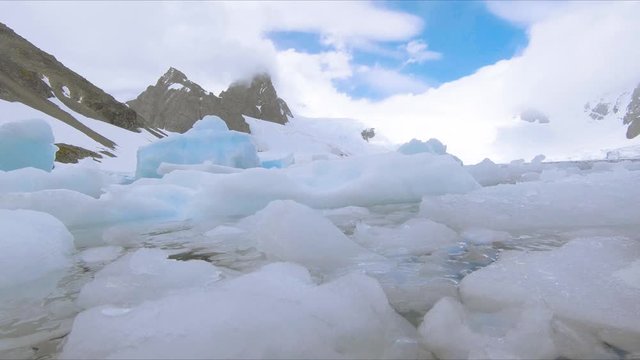 Crushed ice floating in frozen Antarctic bay global warming
