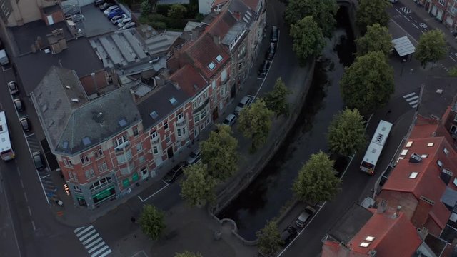 The dark moving city of leuven with the dijle canal in the Aerial view