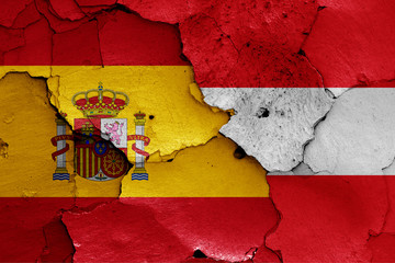 flags of Spain and Austria painted on cracked wall
