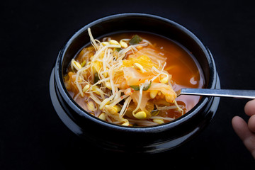 Kimchee and bean sprout soup which is called kimchee kongnamul guk in Korean