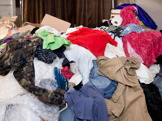 Large pile of items, clothes, household items filling a room in a house © Del Henderson Jr    