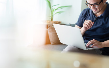 using computer.asian man hand typing message keyboard laptop shopping online.search information...