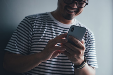using cell phone.hand holding texting message on screen mobile chatting friend ,search internet information.technology device contact communication connecting people concept
