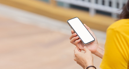 Mockup image blank white screen cell phone.woman hand holding texting using mobile.background empty space for advertise text.people contact marketing business,technology 