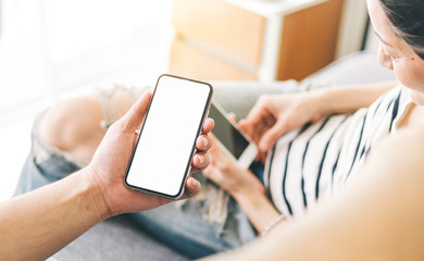 Mockup image blank white screen cell phone.woman hand holding texting using mobile.background empty space for advertise text.people contact marketing business,technology 