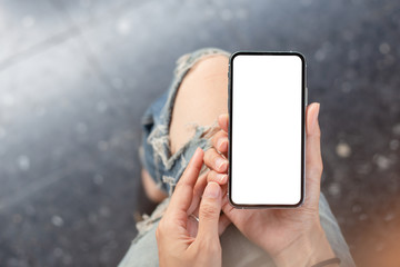 Mockup image blank white screen cell phone.woman hand holding texting using mobile.background empty space for advertise text.people contact marketing business,technology 
