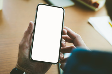 Mockup image blank white screen cell phone.woman hand holding texting using mobile.background empty space for advertise text.people contact marketing business,technology 