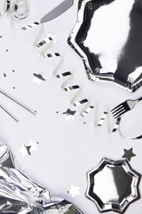 white silver party decoration event flatlay light wedding event celebration decoration confetti glas eating table cute paper plate black white metallic