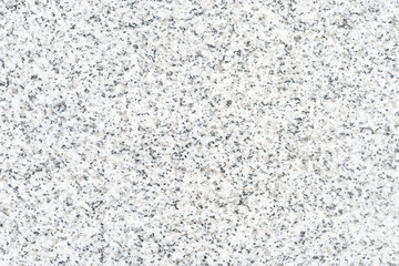 Real granite stone texture in top view. Natural material with gray abstract texture pattern of mineral, quartz. Smooth surface for decorative wall, floor, countertop, slab in bathroom and kitchen.