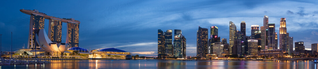 Super wide panorama of Singapore skyscrapers at magic hour - obrazy, fototapety, plakaty