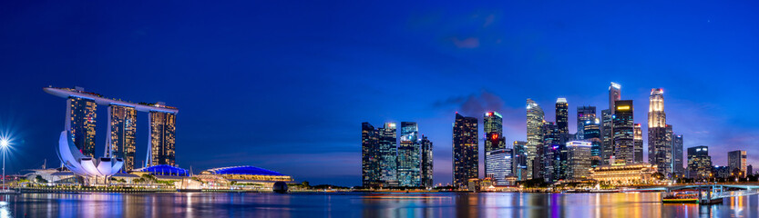 Fototapeta na wymiar Super wide panorama of Singapore skyscrapers at magic hour