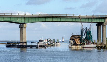 Fototapeta na wymiar Fishing Shrimp Boats Moored at a Dock at a Marina