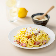 Pasta carbonara with parmesan and bacon on white background.Italian food style.