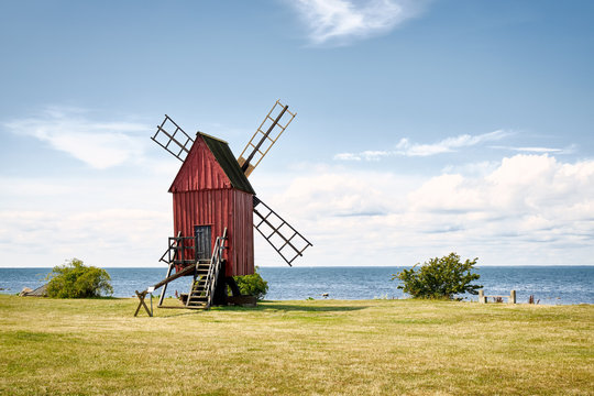 Windmill on the shore edge facing Kalmarsund on the Swedish island Oland.