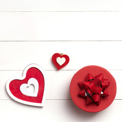 Valentines Day composition. Heart, gift on white wooden surface. Valentine's day concept. Flat lay, top view, from above