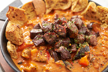 Beef steak with tomato sauce and bread 