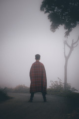 silhouette of man in fog