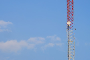 Microwave dish on structured antenna with copy space on blue sky background