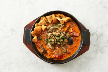 Grilled oyster with tomato sauce 