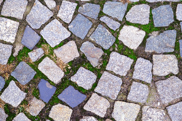 Texture of old Cobbled Pavement close-up. Abstract Granite Background..