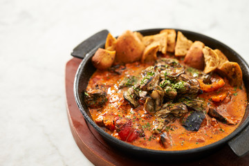 Grilled oyster with tomato sauce 