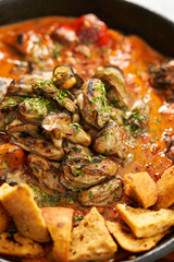 Grilled oyster with tomato sauce 