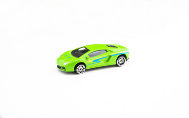 Fototapeta na wymiar green toy racing car on a white background