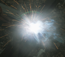 sparks from metal welding at a construction site