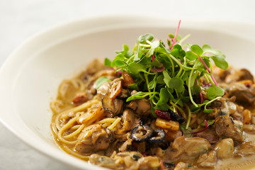 Oyster and garlic spaghetti studio shot 
