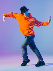 Boy dancing contemporary dance in studio. Breakdancing. - obrazy, fototapety, plakaty