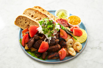 Beef steak, fruit, bread sauce on plate 