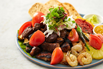 Beef steak, fruit, bread sauce on plate 