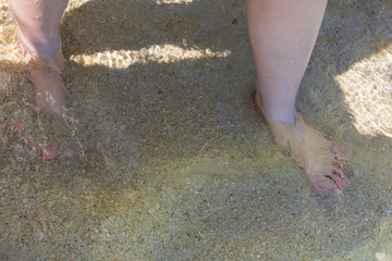 feet on the beach
