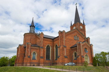 Fototapeta na wymiar Old neo-Gothic Lutheran church closeup on a cloudy June day. Loviisa, Finland
