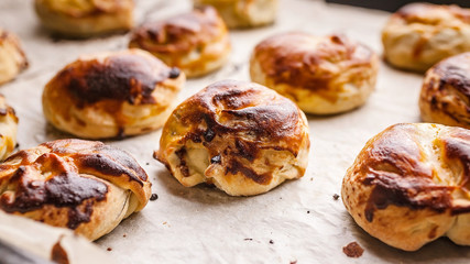 Food banner homemade sweet buns with salted caramel and nuts. Selective focus. Close up