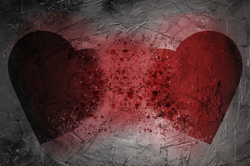 Two dissolving hearts on a dark gray concrete wall background