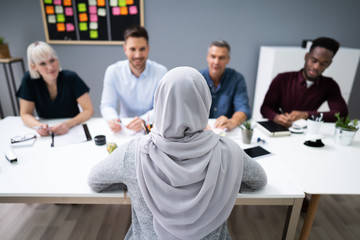 Muslim Woman In Hijab Sitting At Interview