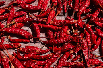 dried chili peppers on wooden background